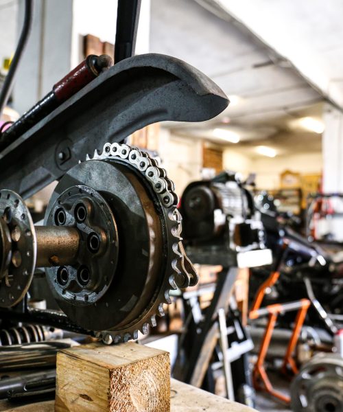 Disassembled bike against the background of the garage, repair. Motor sports.Part of motorcycle close up